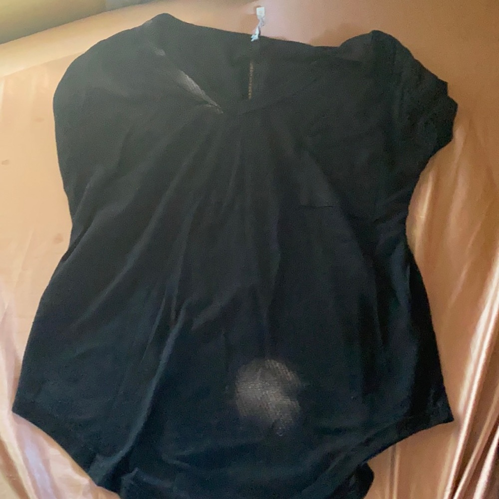 Black shirt. Not a stain just the light